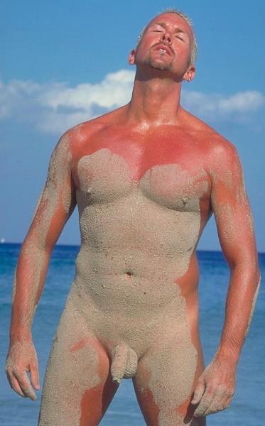 sandy man beach wrestling covered in dirty mud